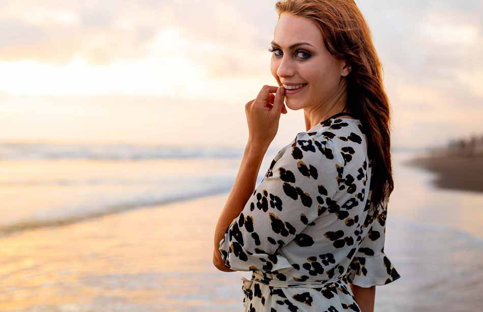 Beautiful woman in black and white dress smiles on Bali beach | Fashion Photography | Lifestyle Photography | Canggu, Bali, Indonesia | Cute Dress | Portrait |